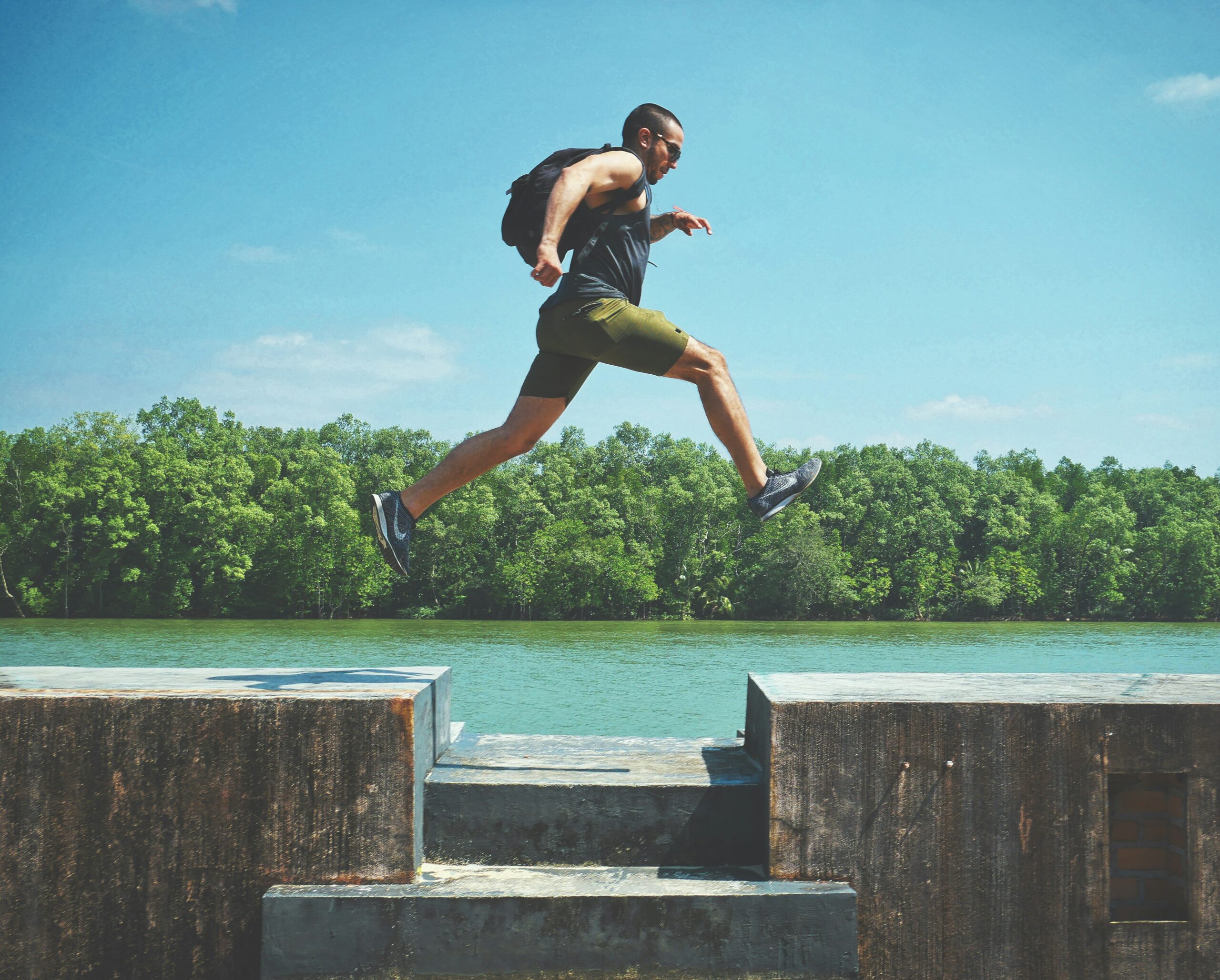 Man running by river